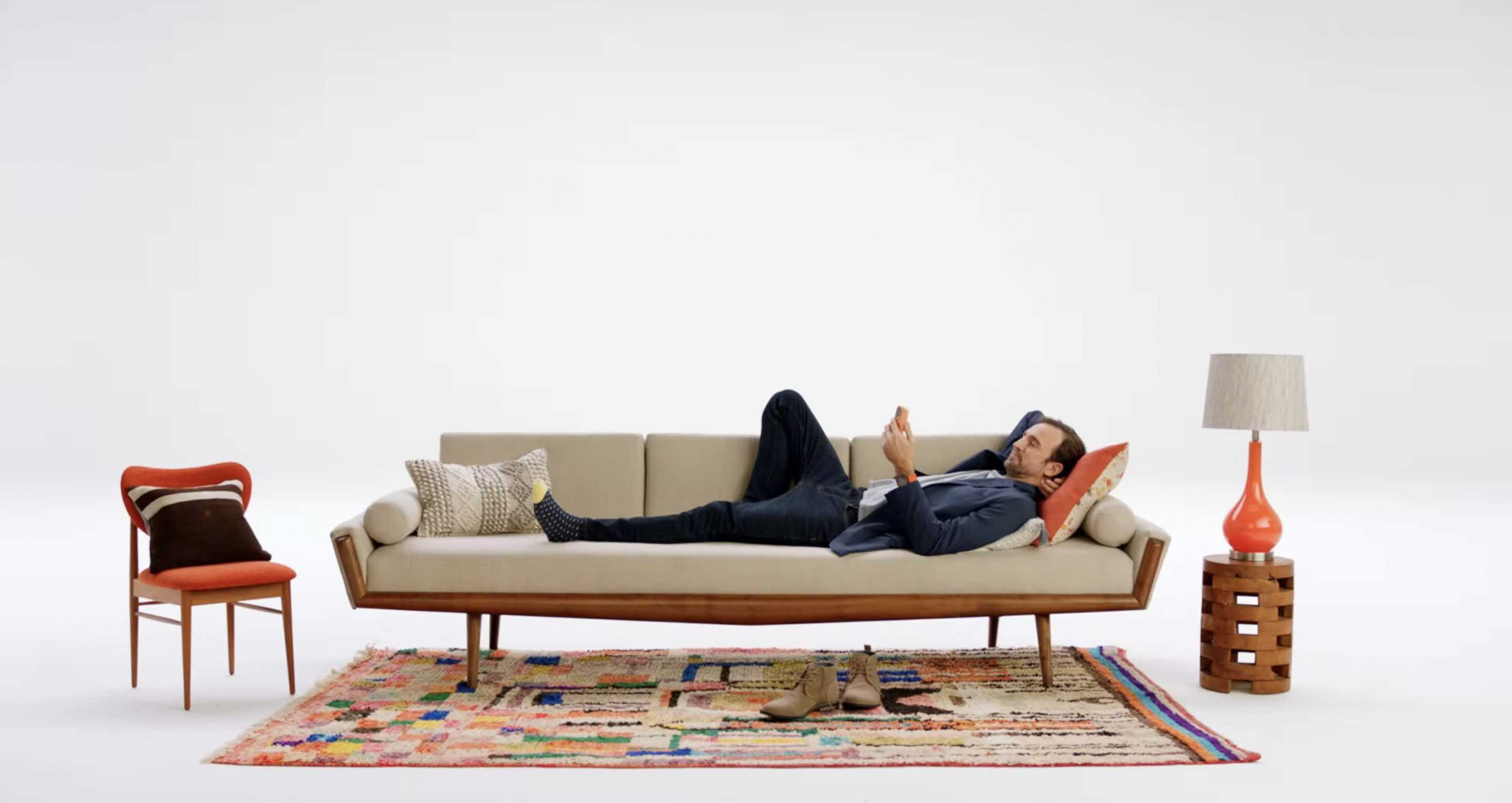 Eargo commercial still man on couch