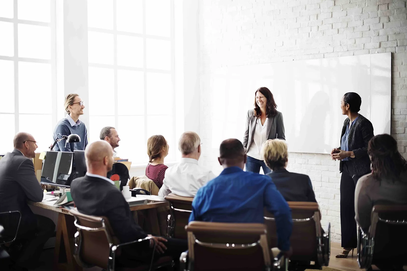 Image of a group of people having a meeting in a professional office setting