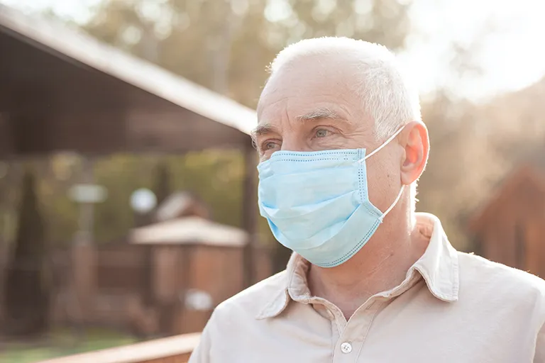 Man wearing face mask outdoors