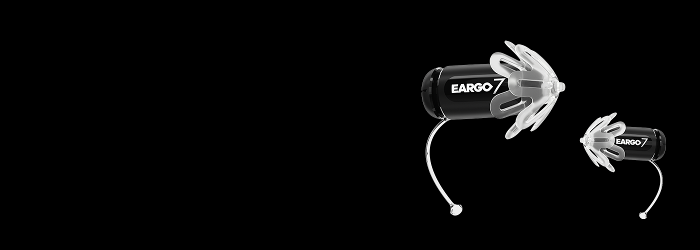 Eargo 7 hearing aids on black background